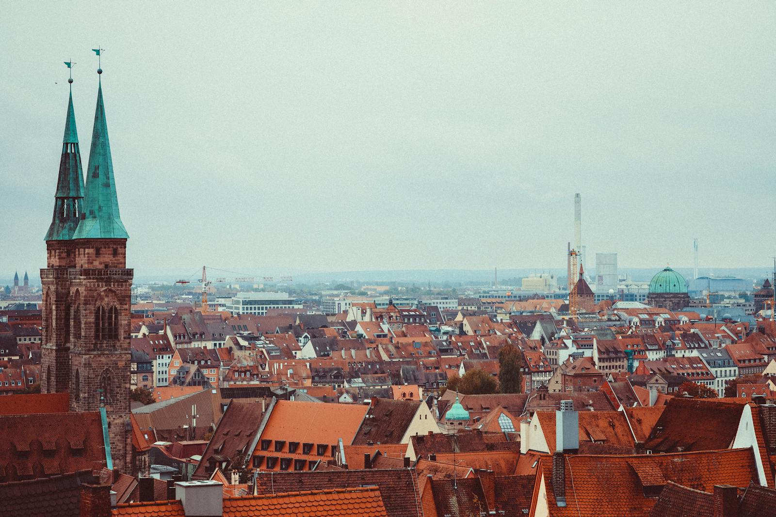 A picturesque view of Nürnberg's old town with Gothic architecture and urban skyline.