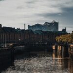 Dramatic evening view of Hamburg's iconic Speicherstadt canal and buildings.