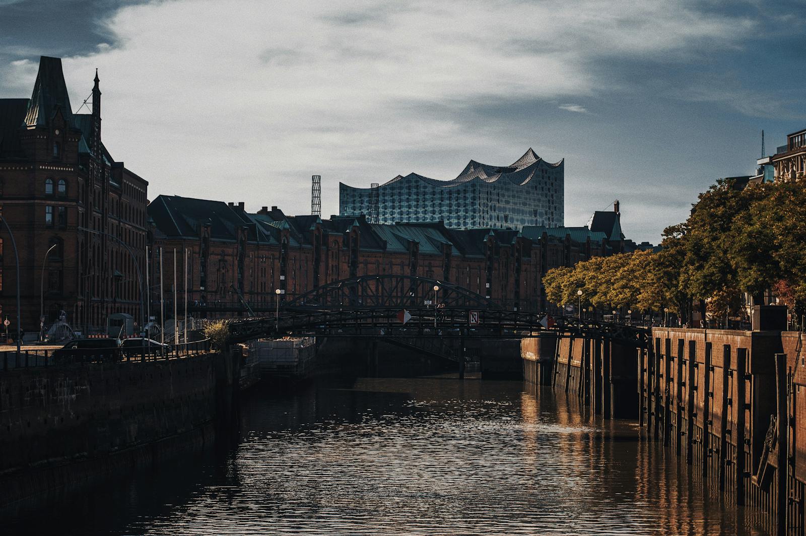 Dramatic evening view of Hamburg's iconic Speicherstadt canal and buildings.