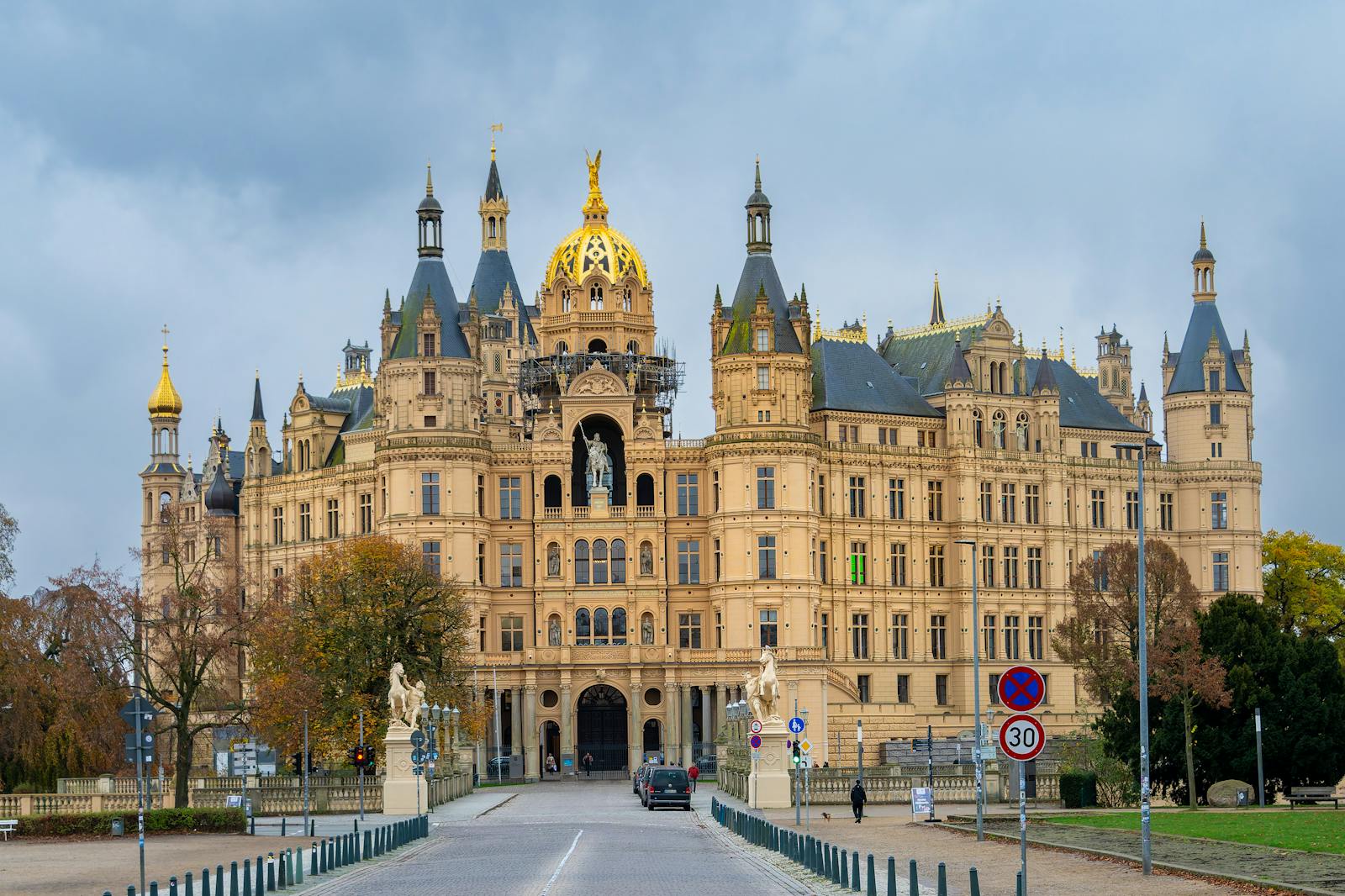 Stunning view of Schwerin Castle, a landmark in Germany, captured during autumn showcasing its grand architecture.