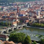 a river running through a city next to a bridge