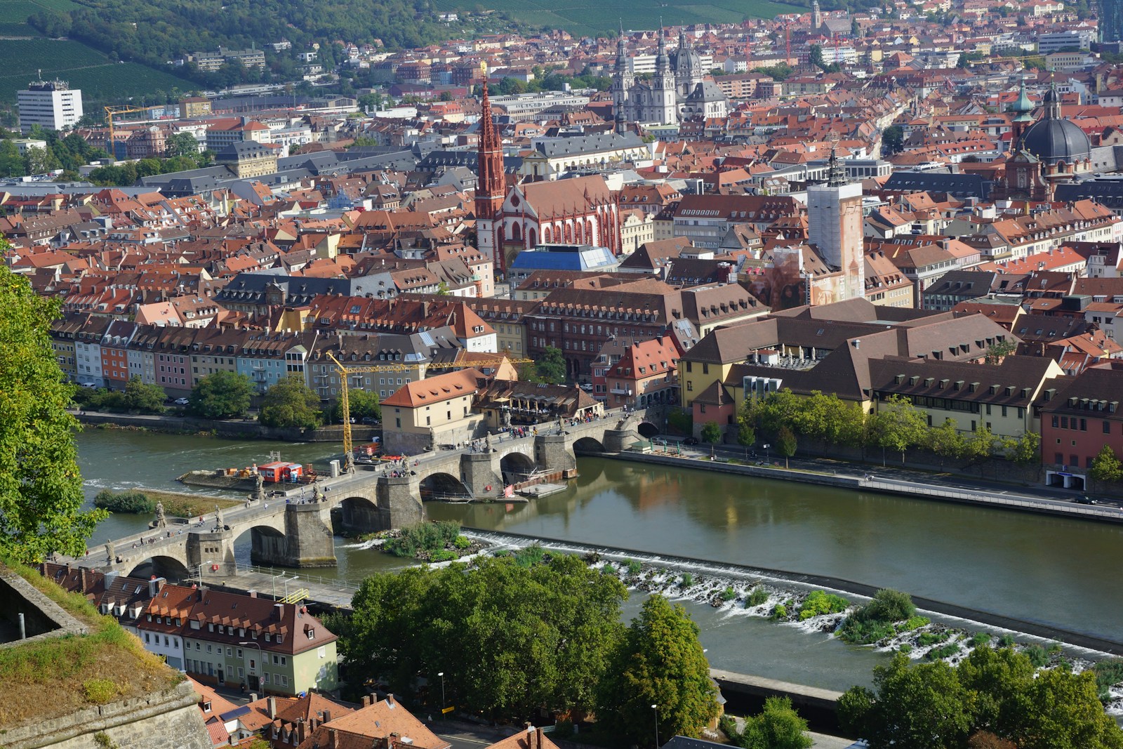 a river running through a city next to a bridge